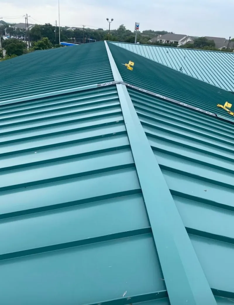 Green commercial metal roof ridge and valley for Metal Roof Repair in Geddes