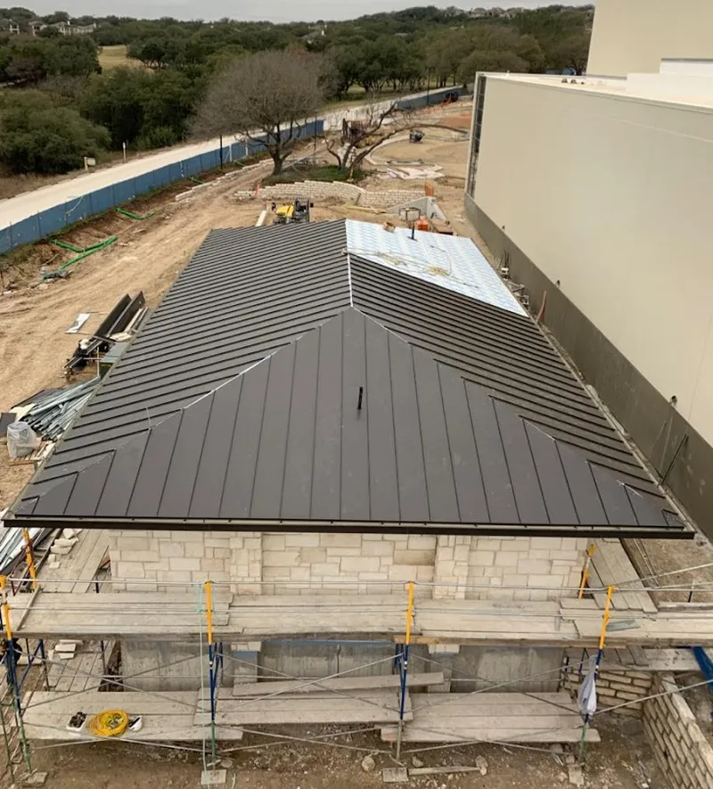 Metal roof new construction with scaffolding in Geddes